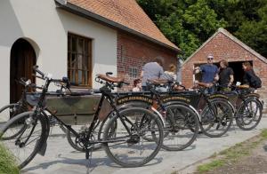 a group of bikes parked next to a building at Bed in Boat in Ypres