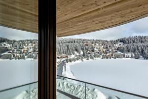 a view from the window of a ski lodge at Postresidenz am See in Arosa