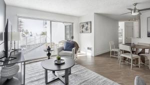 a living room with a couch and a table at Landing - Modern Apartment with Amazing Amenities (ID7827X62) in Redondo Beach