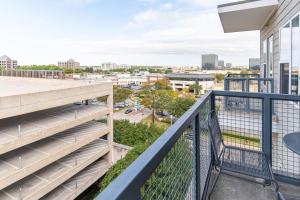 a balcony with a view of a city at Landing - Modern Apartment with Amazing Amenities (ID2255) in Dallas