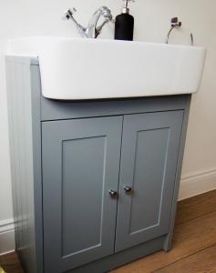 a bathroom vanity with a sink and a white counter at Newly Renovated 3 Bedroom Victorian Detached House in Bournemouth