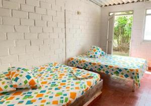 Postel nebo postele na pokoji v ubytování La Granjita Santagueda