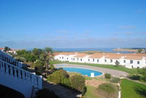 an aerial view of a house with a swimming pool at Fee4Me Menorca, appartment a few minutes from the beach in Arenal d'en Castell