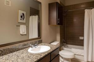 a bathroom with a sink and a toilet and a mirror at Landing - Modern Apartment with Amazing Amenities (ID1776X11) in Austin