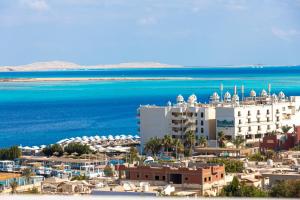 an aerial view of a resort and the ocean at Lazur Hotel Apartments in Hurghada