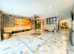 a living room with a couch and a table at Hotel Valladolid in Santa Marta