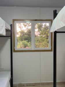 Voodi või voodid majutusasutuse JAZMIN HOsTEL toas