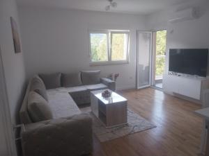 a living room with a couch and a table at Milica in Trebinje