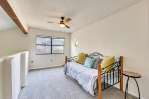 a bedroom with a bed and a ceiling fan at Shalimar Townhome with Screened Porch 6 Mi to Beach in Shalimar