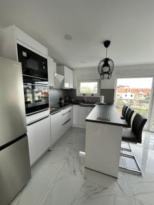 Kuchyň nebo kuchyňský kout v ubytování Apartman Garden Vodice