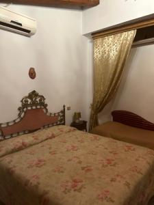 a bedroom with a bed and a window at Locanda verde in Vaiano