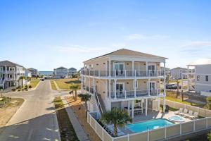 an aerial view of a house with a swimming pool at All the Views Ocean Isle Beach, heated private pool, close to beach in Ocean Isle Beach
