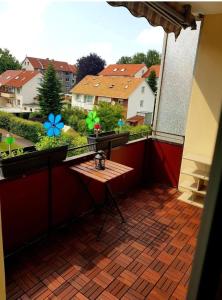 a balcony with a table and a view of a city at Hannover City Suite in Hannover