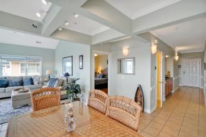 a living room with a couch and a table at Ain`t It The Life Brunswick Vacation Rentals in Ocean Isle Beach