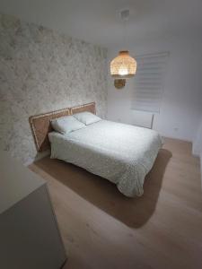 Ein Bett oder Betten in einem Zimmer der Unterkunft Maison