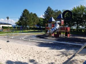 a playground in a park with a slide at HollyJess Hoose in Stranraer