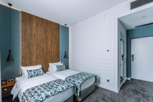 Postel nebo postele na pokoji v ubytování Hotel Twenties Tbilisi - Stay & Dine