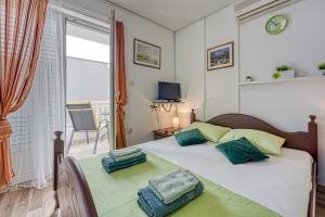 Posteľ alebo postele v izbe v ubytovaní Studio Apartmani Ivanda