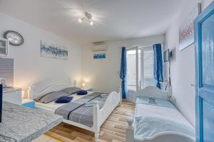Posteľ alebo postele v izbe v ubytovaní Studio Apartmani Ivanda