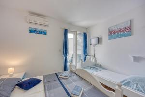 Posteľ alebo postele v izbe v ubytovaní Studio Apartmani Ivanda