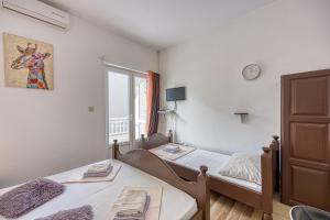 Posteľ alebo postele v izbe v ubytovaní Studio Apartmani Ivanda