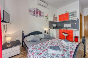 Posteľ alebo postele v izbe v ubytovaní Studio Apartmani Ivanda