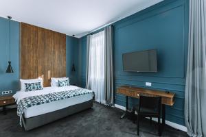 Postel nebo postele na pokoji v ubytování Hotel Twenties Tbilisi - Stay & Dine