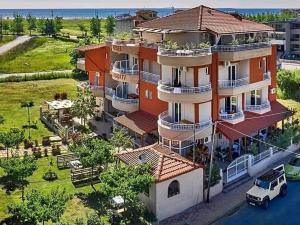 an aerial view of a large house with a car parked in front at Afroditi in Paralia Katerinis