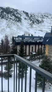 a view of a building with snow on the ground at Apartamento Riglos2 Candanchu in Candanchú