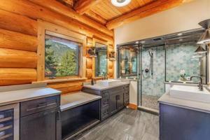 a large bathroom with two sinks and a shower at Luxury Family Cabin at Summit West in Snoqualmie Pass