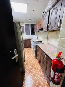 a kitchen with a fire hydrant in the middle of it at Single Partition Room in Al Barsha 1 Near Mashreq Metro in Dubai