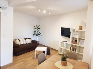 a living room with a couch and a table at Accommodation Huljić in Hvar