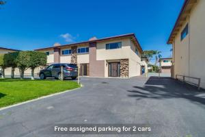 a car parked in front of a building at Entire Spacious 3-Bedroom Home w King Bed & Free Parking- 5 mins to Bay, Beach, No Deposit in Chula Vista