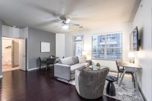 a living room with a couch and a table at Landing - Modern Apartment with Amazing Amenities (ID5045X8) in San Antonio