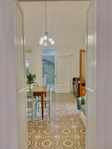 a dining room with a table and a dining roomiasm at Dimora salenTina in Tricase