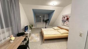 Postel nebo postele na pokoji v ubytování Moderne Appartement