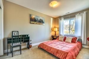 a bedroom with a bed and a window at Alberta Arts District Home with Private Hot Tub! in Portland