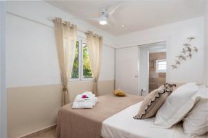 Postel nebo postele na pokoji v ubytování Villa Olina - Vue sur Mer, Piscine, 5min du Port