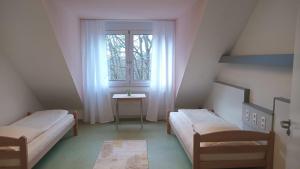 Postel nebo postele na pokoji v ubytování Moderne Appartement