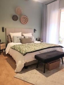 Posteľ alebo postele v izbe v ubytovaní le J&J Appartement spacieux climatisé en centre ville