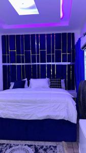 Postel nebo postele na pokoji v ubytování TM Royal Hotel, Ibadan