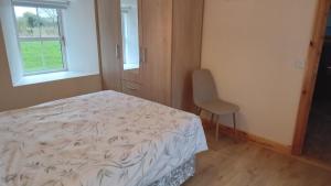 Postel nebo postele na pokoji v ubytování Boola Cottage