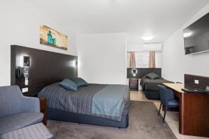 Postel nebo postele na pokoji v ubytování El Motor Inn