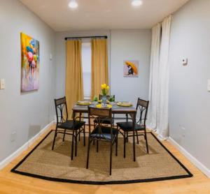 a dining room with a table and chairs at New Beautiful Condo In Bayonne near NYC. in Bayonne