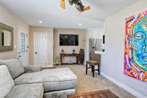 a living room with a couch and a tv at Ocean View Spa Retreat, Hot Tub, Sauna, Close to the beach, 9 sleeps in Oceanside