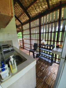 a kitchen with a sink and a counter top at Islas Moriones Beach Resort in Maniwaya