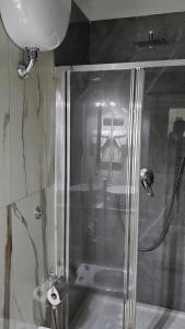 a shower with a glass door in a bathroom at HOTEL CRISARI in Naples