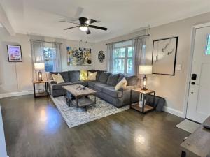 a living room with a couch and a table at Urban Get-A-Way in Historic St Pete EAT SHOP PLAY in St Petersburg