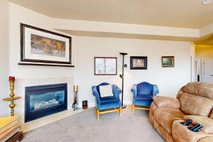 a living room with a couch and a fireplace at Cedar City Sanctuary in Cedar City