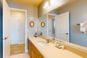 a bathroom with a sink and a mirror at Cedar City Sanctuary in Cedar City +20 photos